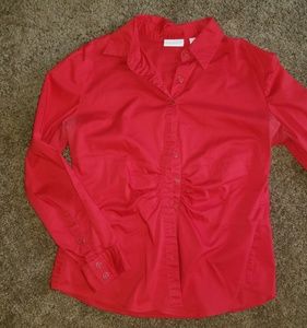 Long sleeved fitted button up blouse.